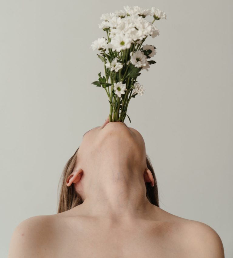 Girl with flowers in the mouth